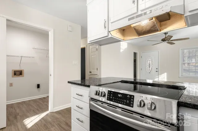 a kitchen with a stove and a microwave