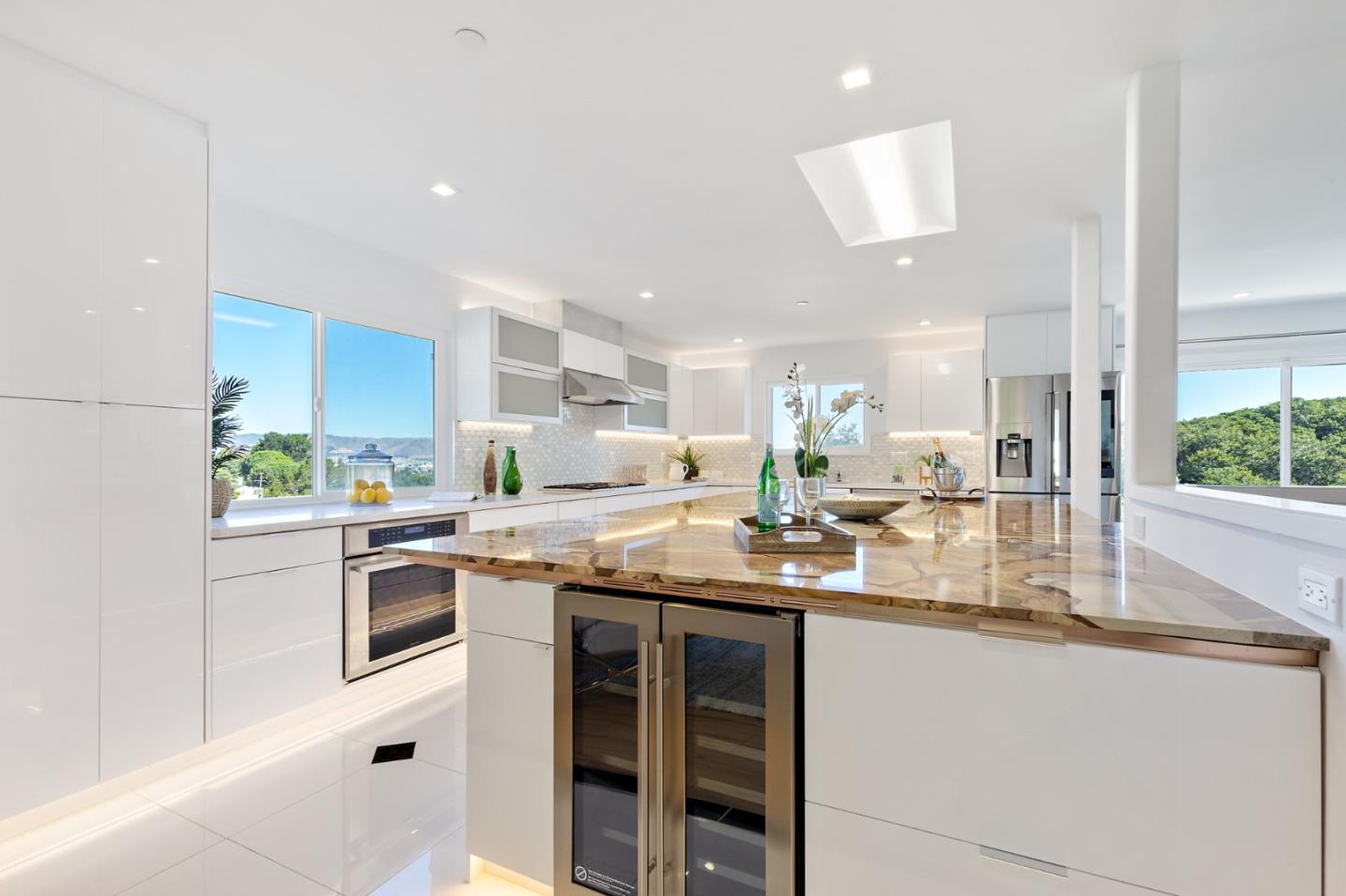 22 Bertocchi Lane Millbrae, CA 94030 - Photo 11 of 50 a kitchen with stainless steel appliances granite countertop a sink and a refrigerator