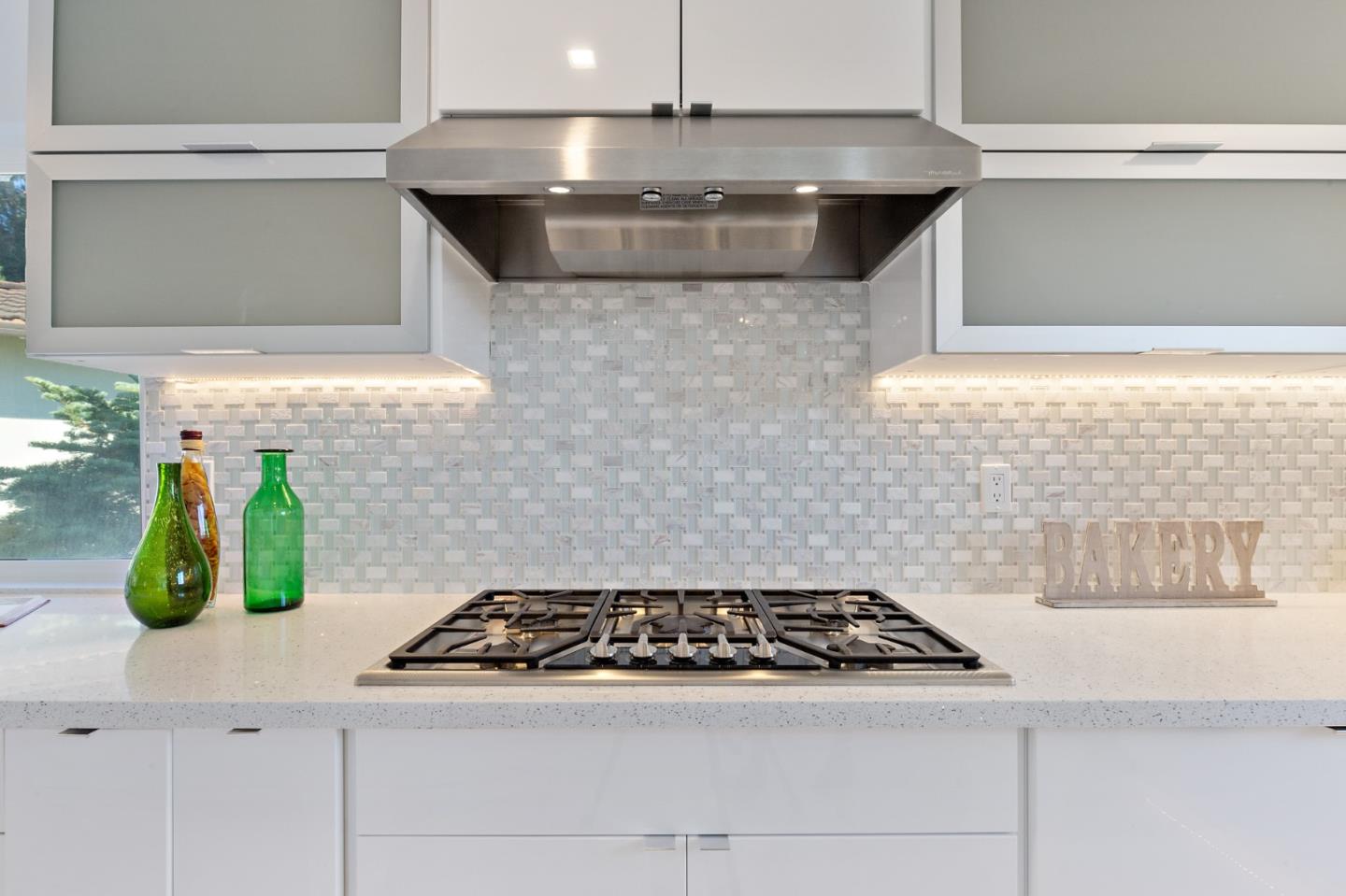 22 Bertocchi Lane Millbrae, CA 94030 - Photo 16 of 50 a kitchen with a stove and cabinets