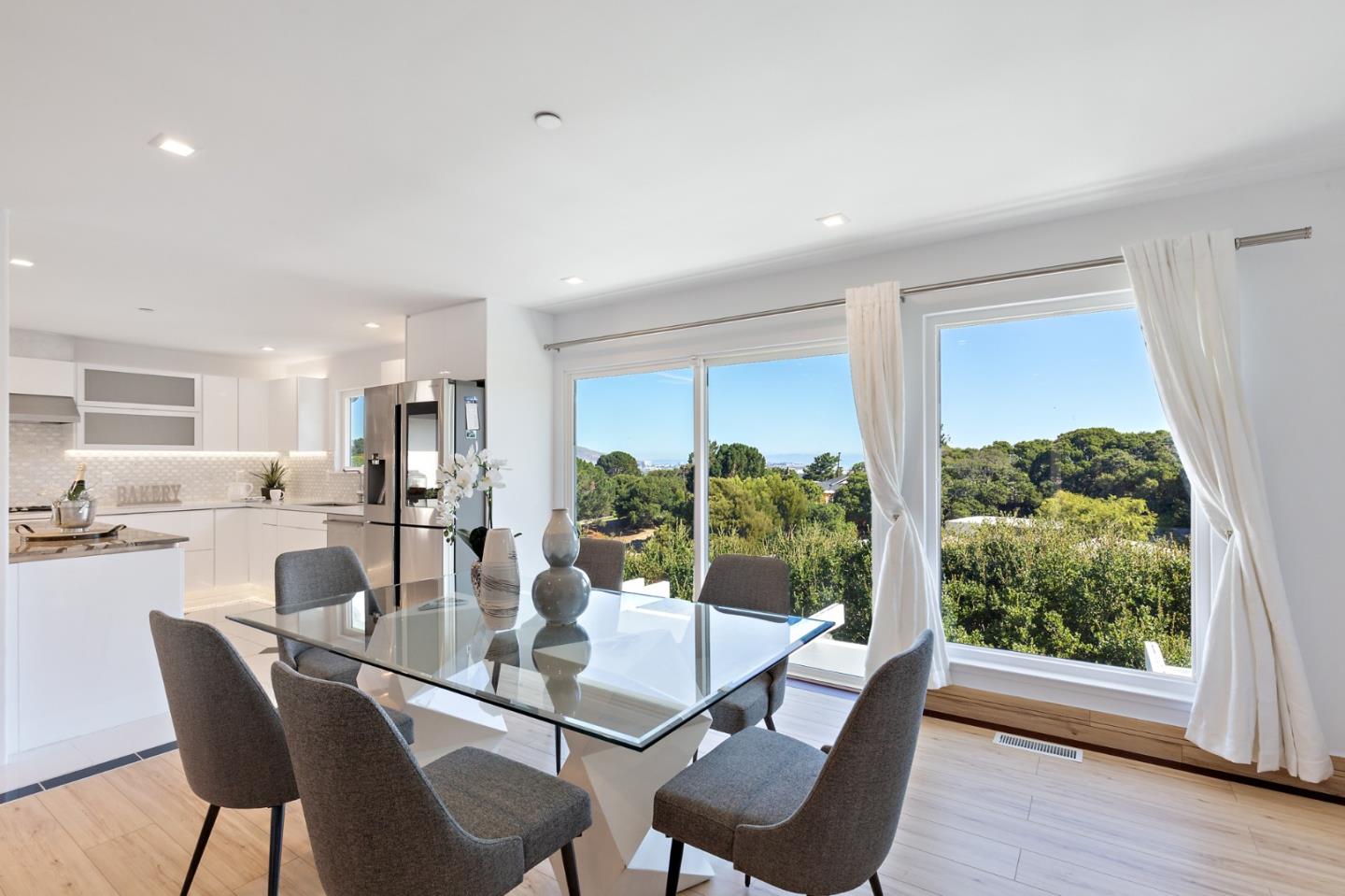 22 Bertocchi Lane Millbrae, CA 94030 - Photo 19 of 50 a dining room with furniture and a large window