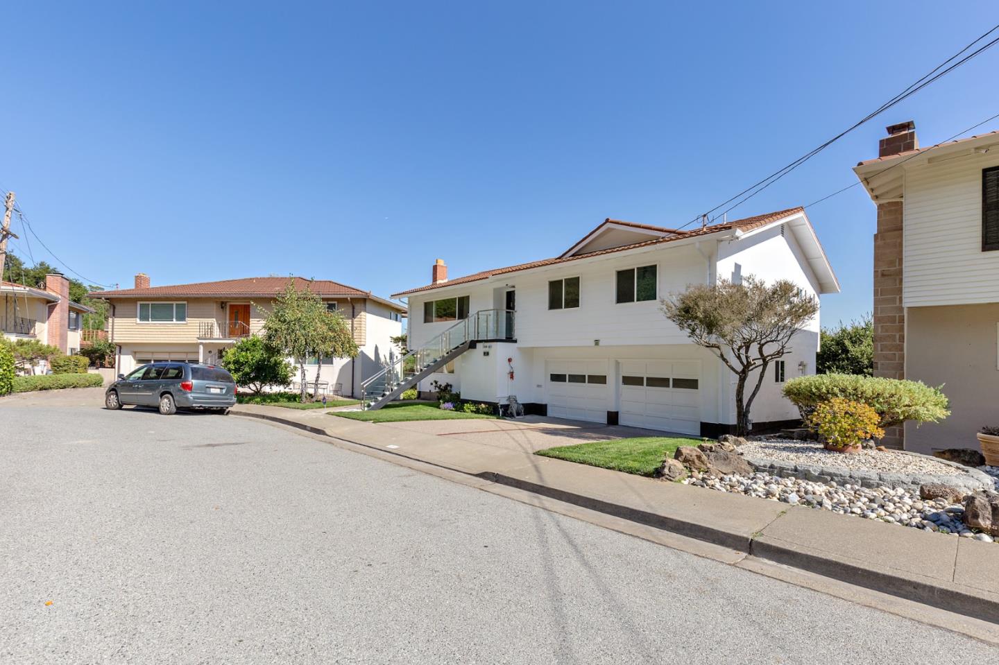 22 Bertocchi Lane Millbrae, CA 94030 - Photo 2 of 50 a front view of a house with a yard and garage