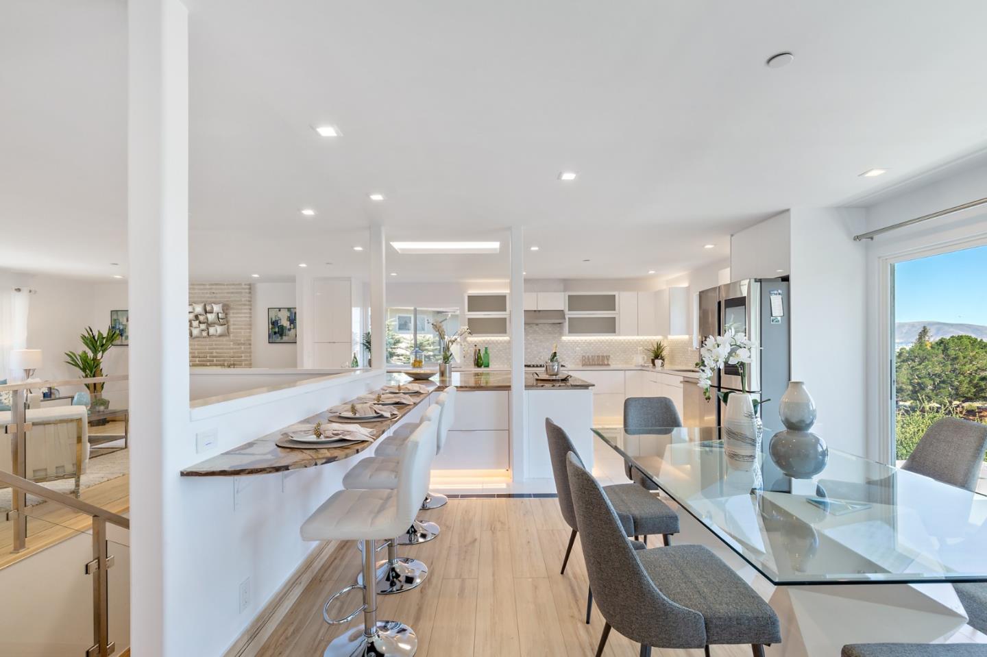 22 Bertocchi Lane Millbrae, CA 94030 - Photo 21 of 50 a large kitchen with kitchen island granite countertop lots of counter space and stainless steel appliances