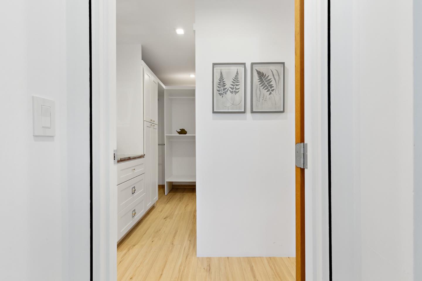 22 Bertocchi Lane Millbrae, CA 94030 - Photo 27 of 50 a view of a hallway with wooden floor