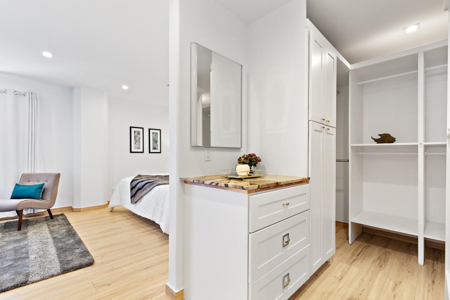 22 Bertocchi Lane Millbrae, CA 94030 - Photo 28 of 50 a bedroom with a bed and a table in it