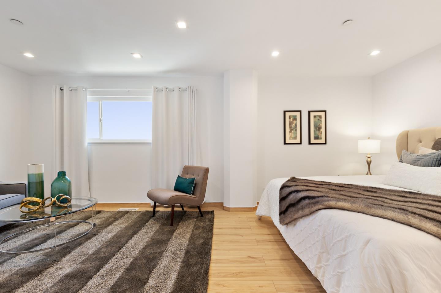 22 Bertocchi Lane Millbrae, CA 94030 - Photo 30 of 50 a bedroom with bed and a couch