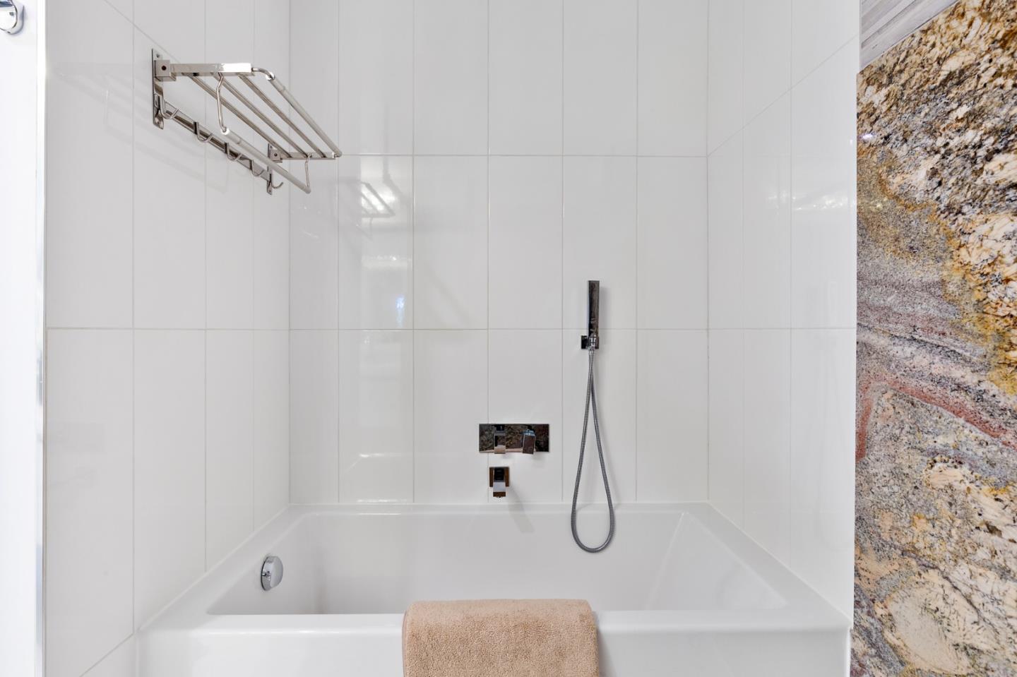 22 Bertocchi Lane Millbrae, CA 94030 - Photo 40 of 50 a bathroom with a bathtub and a shower