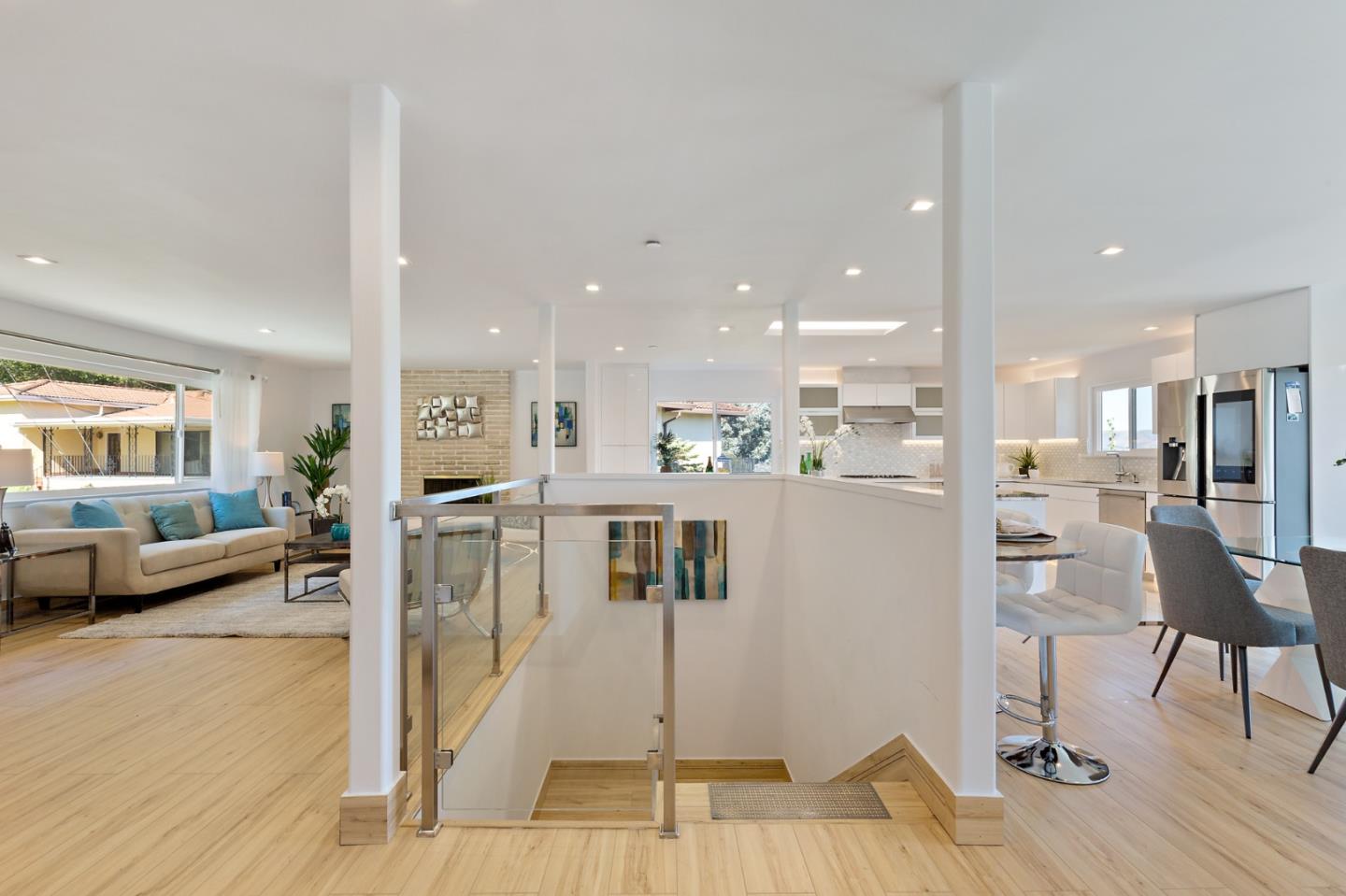 22 Bertocchi Lane Millbrae, CA 94030 - Photo 41 of 50 a view of kitchen with stainless steel appliances kitchen island refrigerator stove dining table and chairs