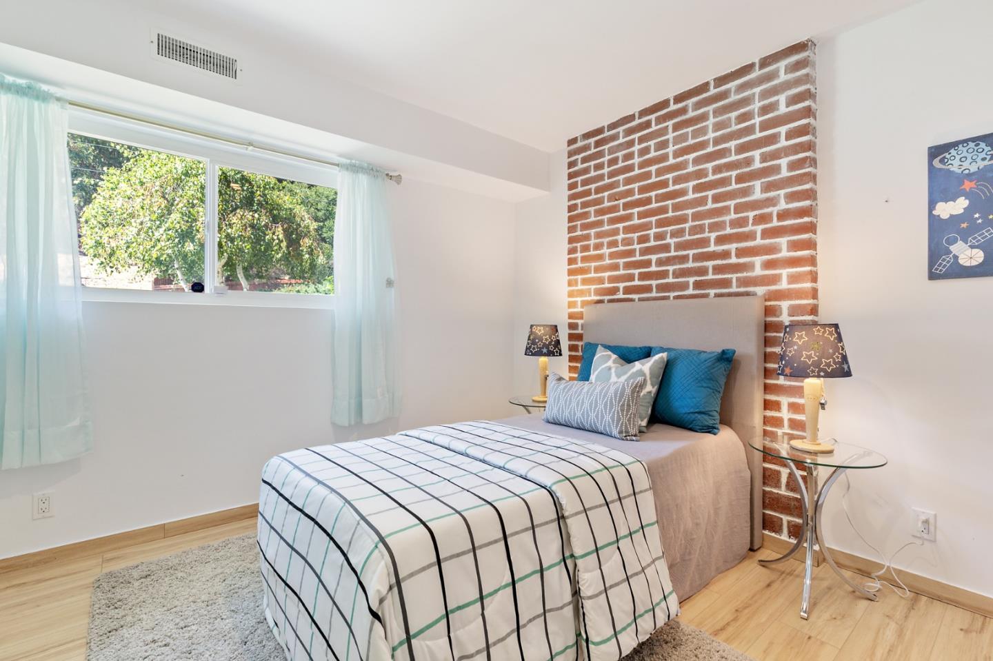 22 Bertocchi Lane Millbrae, CA 94030 - Photo 46 of 50 a bedroom with a bed and a window