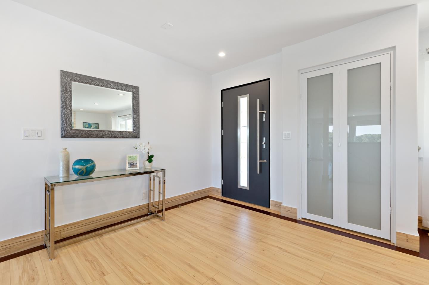 22 Bertocchi Lane Millbrae, CA 94030 - Photo 5 of 50 a view of an empty room with wooden floor and a window