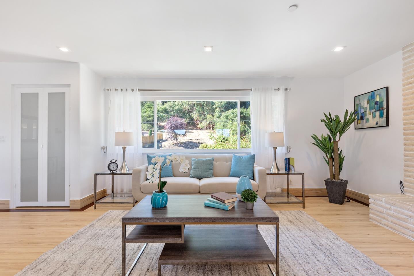 22 Bertocchi Lane Millbrae, CA 94030 - Photo 8 of 50 a living room with furniture and a large window