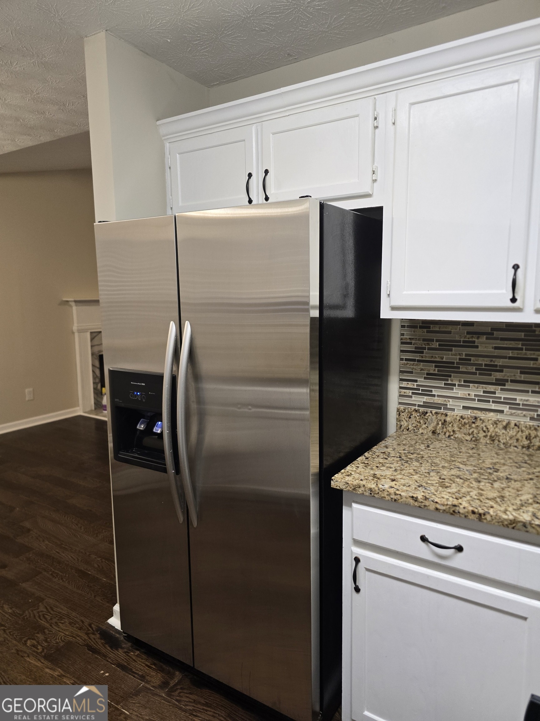 2727 Manor Cove Decatur, GA 30034 - Photo 12 of 16 a kitchen with a refrigerator and cabinets