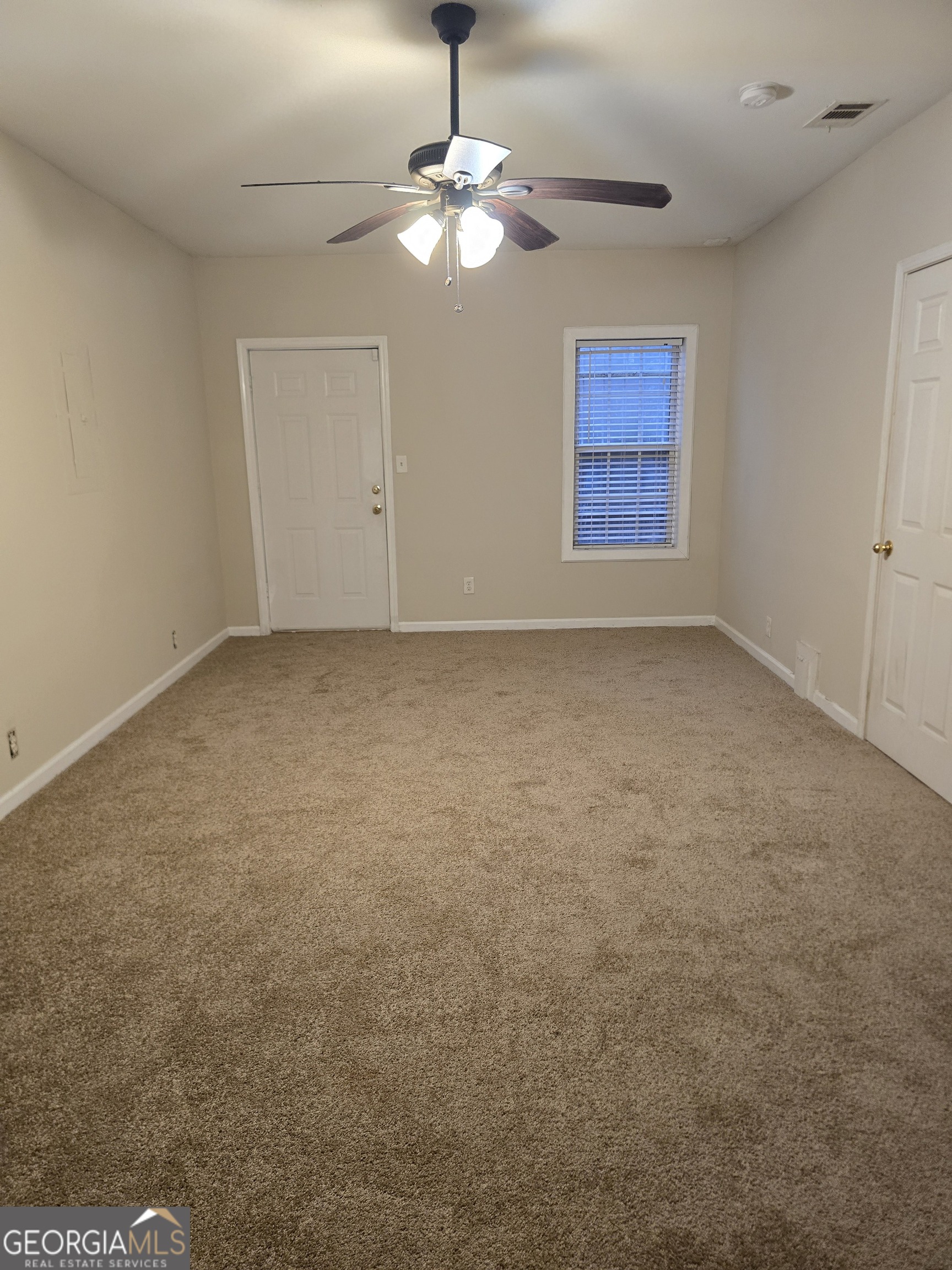2727 Manor Cove Decatur, GA 30034 - Photo 16 of 16 an empty room with chandelier fan