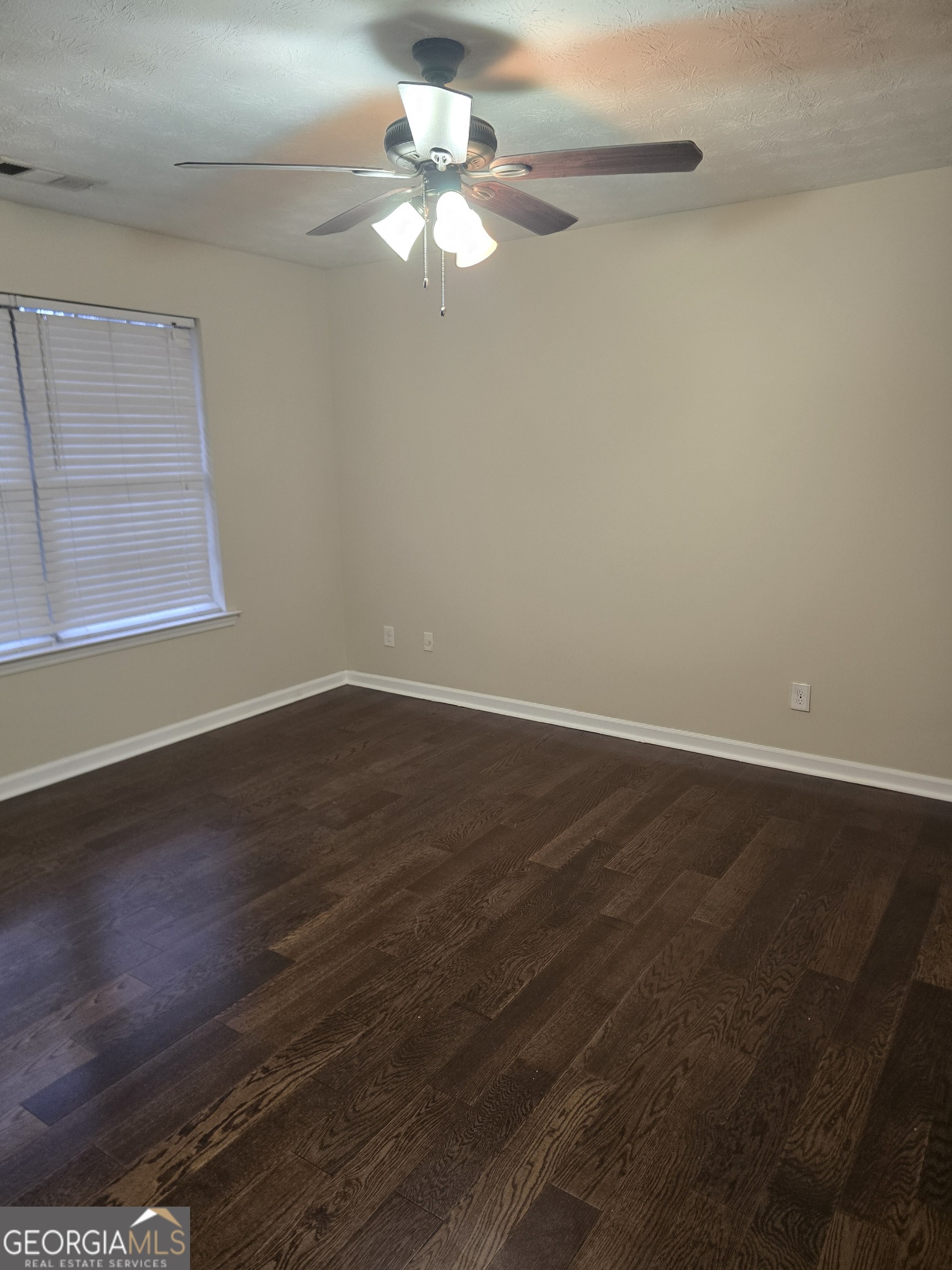 2727 Manor Cove Decatur, GA 30034 - Photo 3 of 16 a view of a room with wooden floor and fan