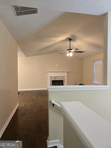 a view of a kitchen with a sink wooden floor and a window