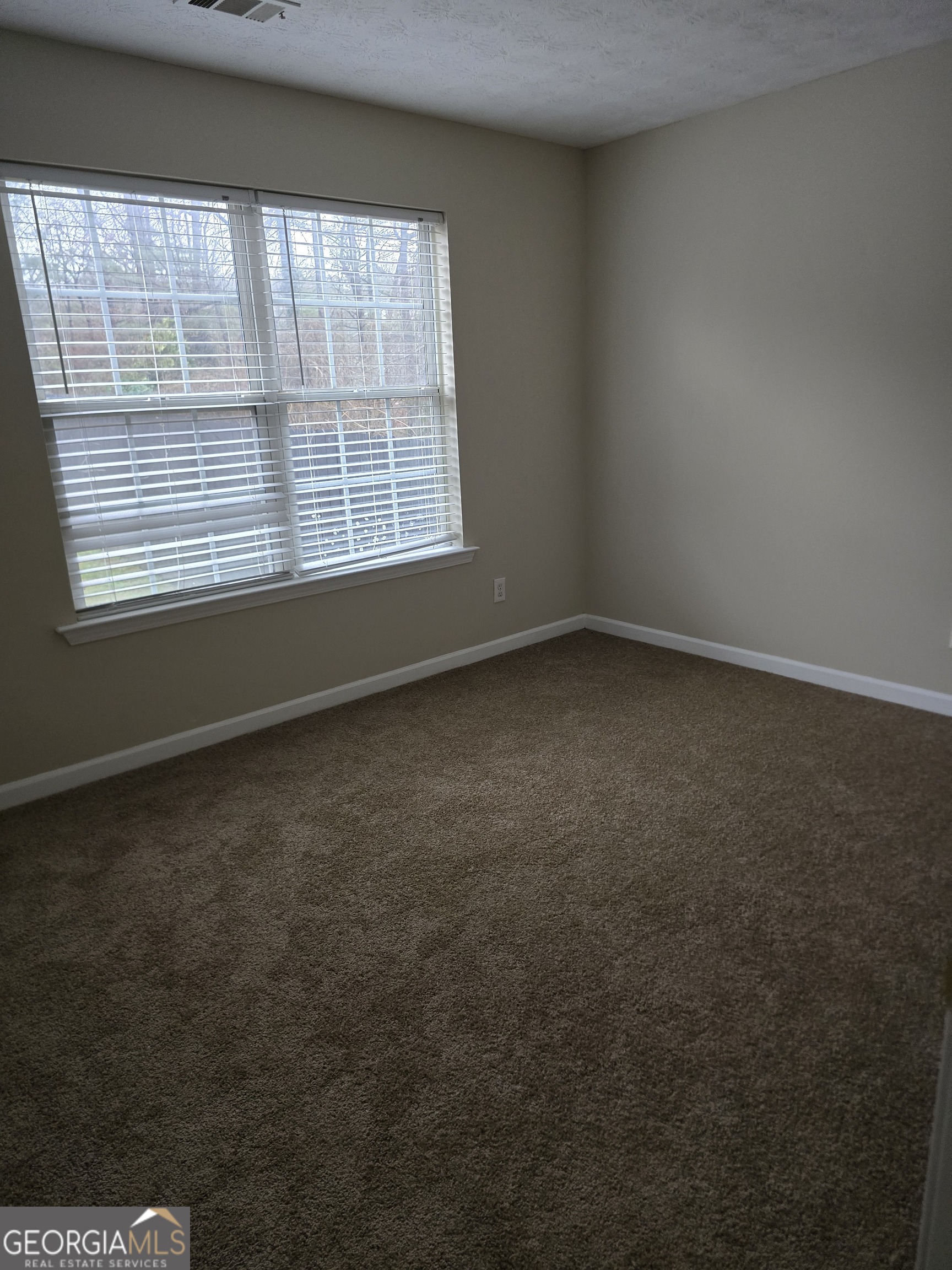 2727 Manor Cove Decatur, GA 30034 - Photo 8 of 16 an empty room with a window