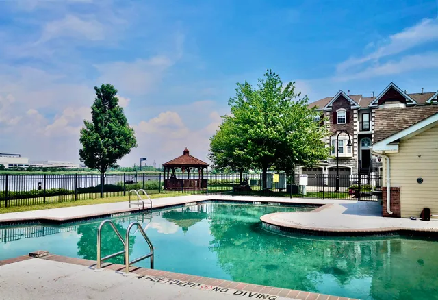 a swimming pool with outdoor seating and yard