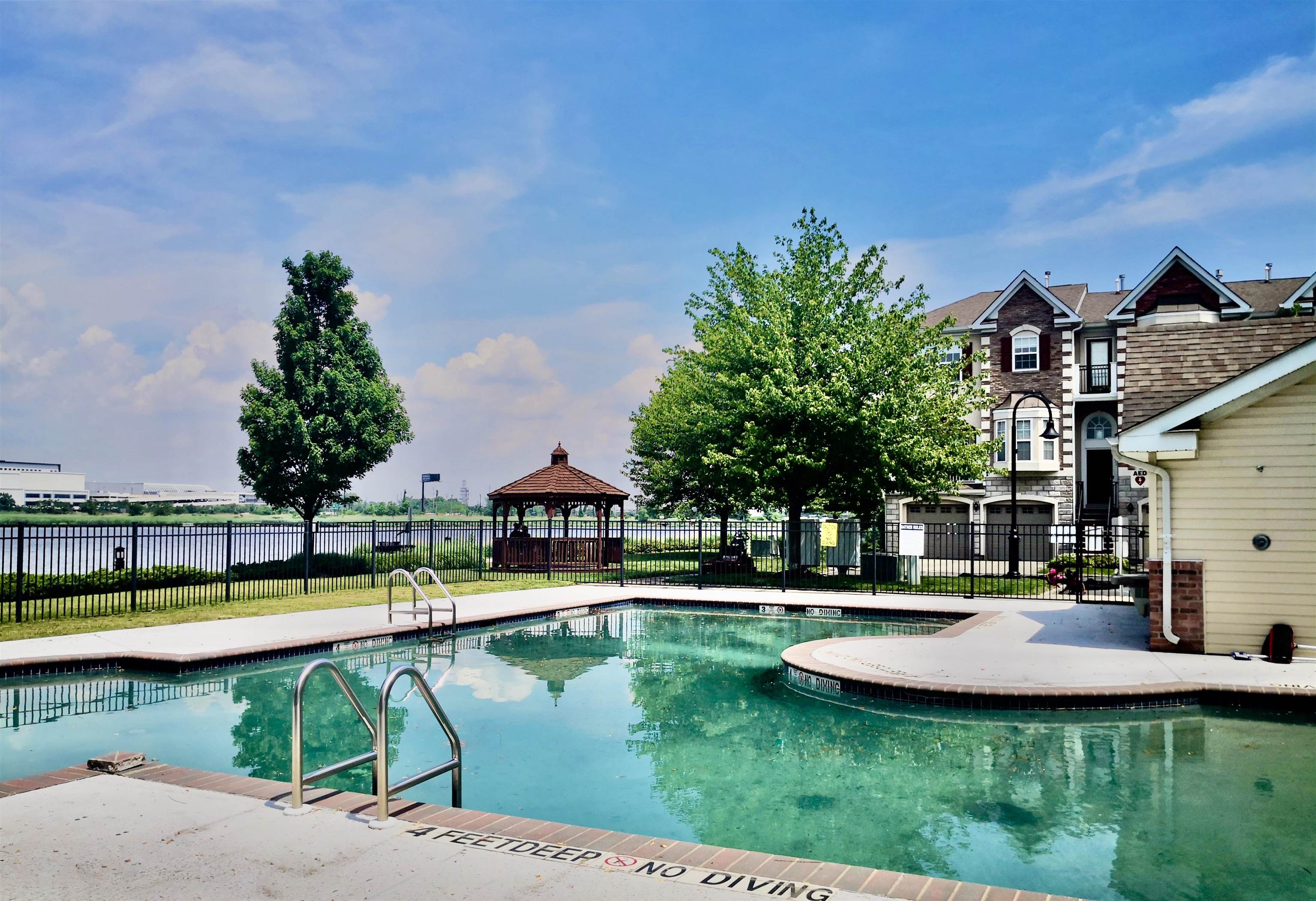 a swimming pool with outdoor seating and yard