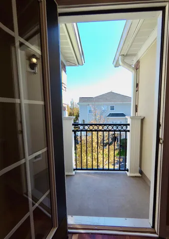 a view of room with wooden floor