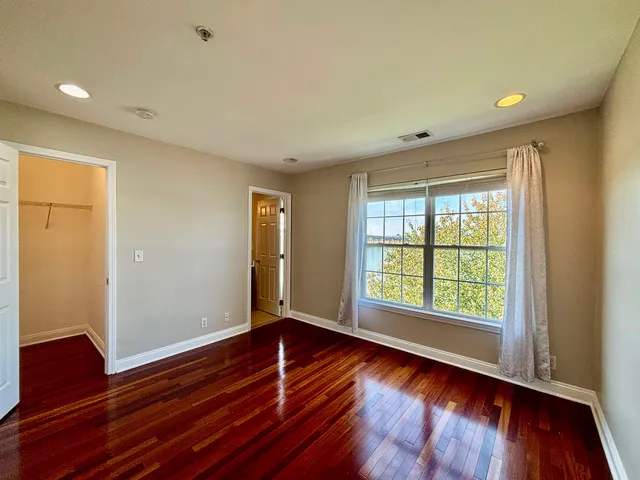 a view of an entryway with wooden floor