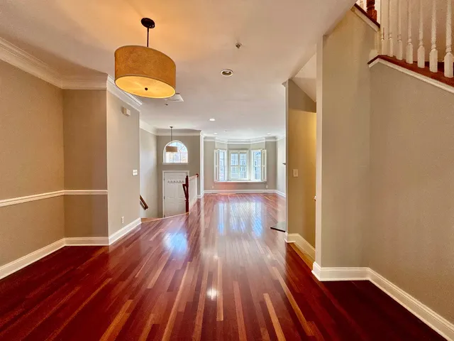 a view of a room with wooden floor and floors