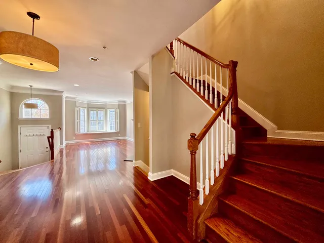 a view of entryway with wooden floor
