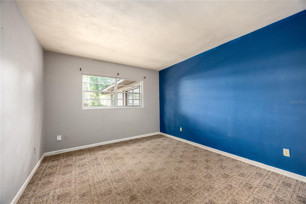 2147 Northwest 7th Place Gainesville, FL 32603 - Photo 23 of 50 an empty room with windows