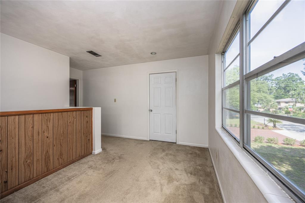 2147 Northwest 7th Place Gainesville, FL 32603 - Photo 29 of 50 a view of an empty room with a window