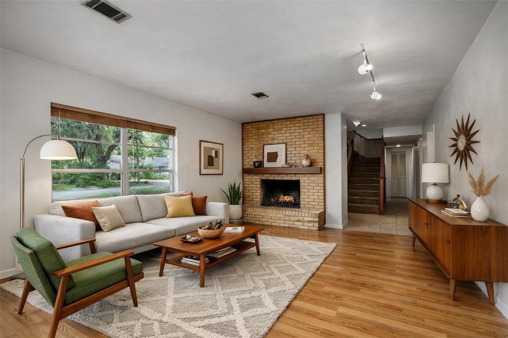2147 Northwest 7th Place Gainesville, FL 32603 - Photo 9 of 50 a living room with furniture and a fireplace