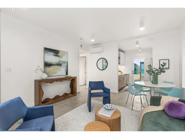 a living room with furniture and a table