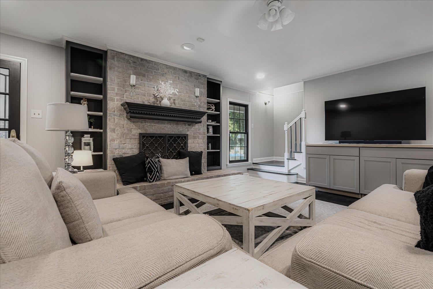 5429 Walnut Grove Road Memphis, TN 38120 - Photo 11 of 37 a living room with furniture and a flat screen tv