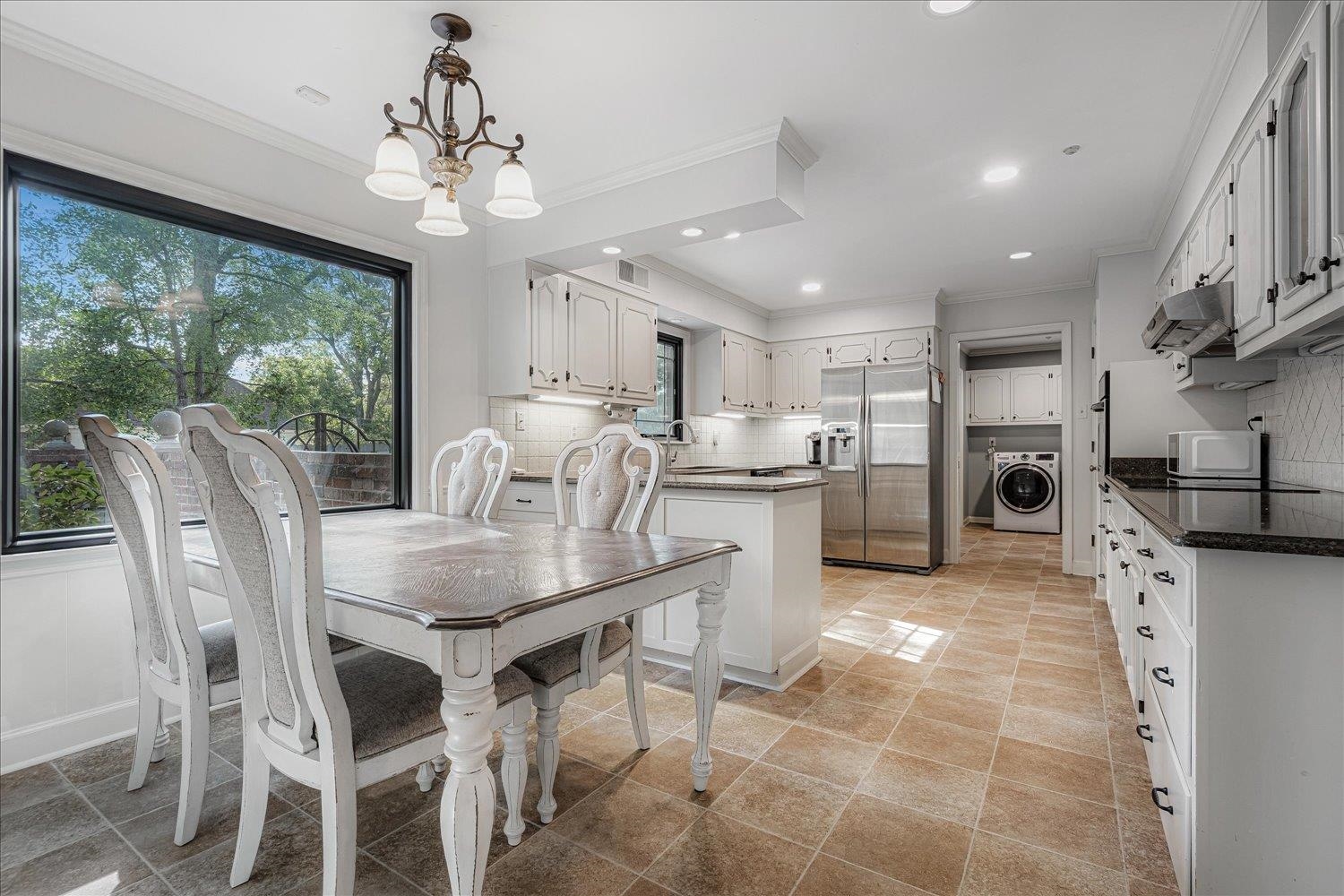 5429 Walnut Grove Road Memphis, TN 38120 - Photo 13 of 37 a view of a dining room with furniture window and outside view