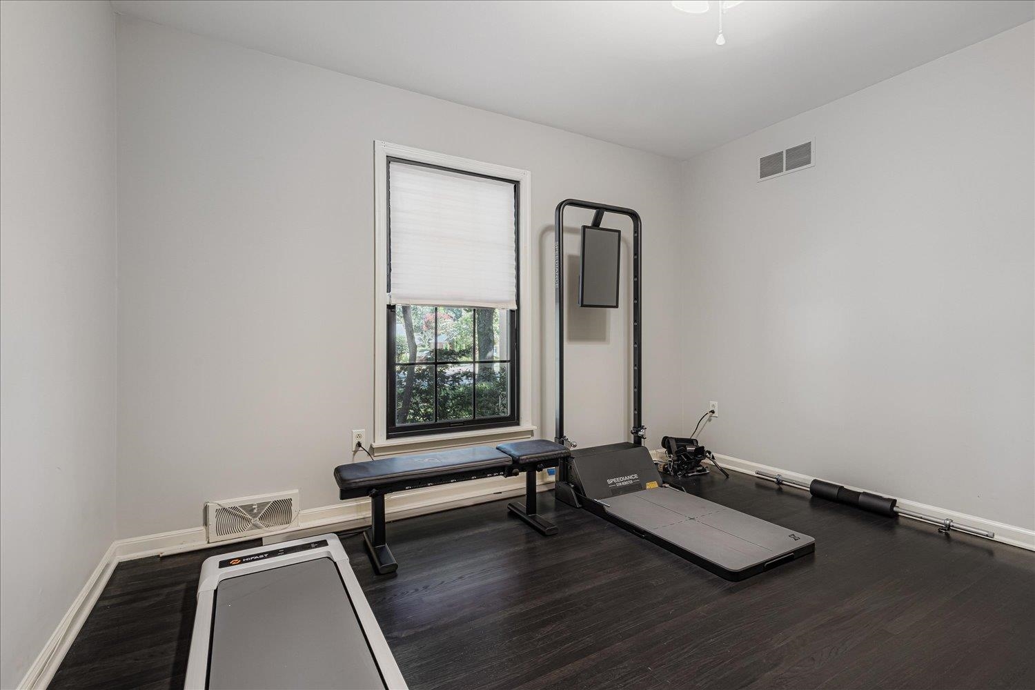 5429 Walnut Grove Road Memphis, TN 38120 - Photo 24 of 37 a room with gym equipment and a large window