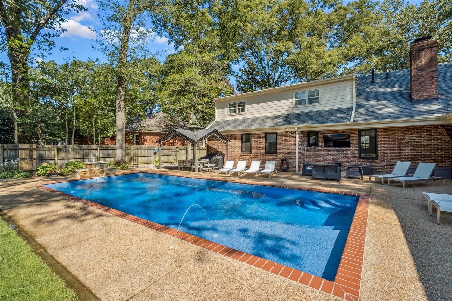 5429 Walnut Grove Road Memphis, TN 38120 - Photo 32 of 37 a view of a house with swimming pool
