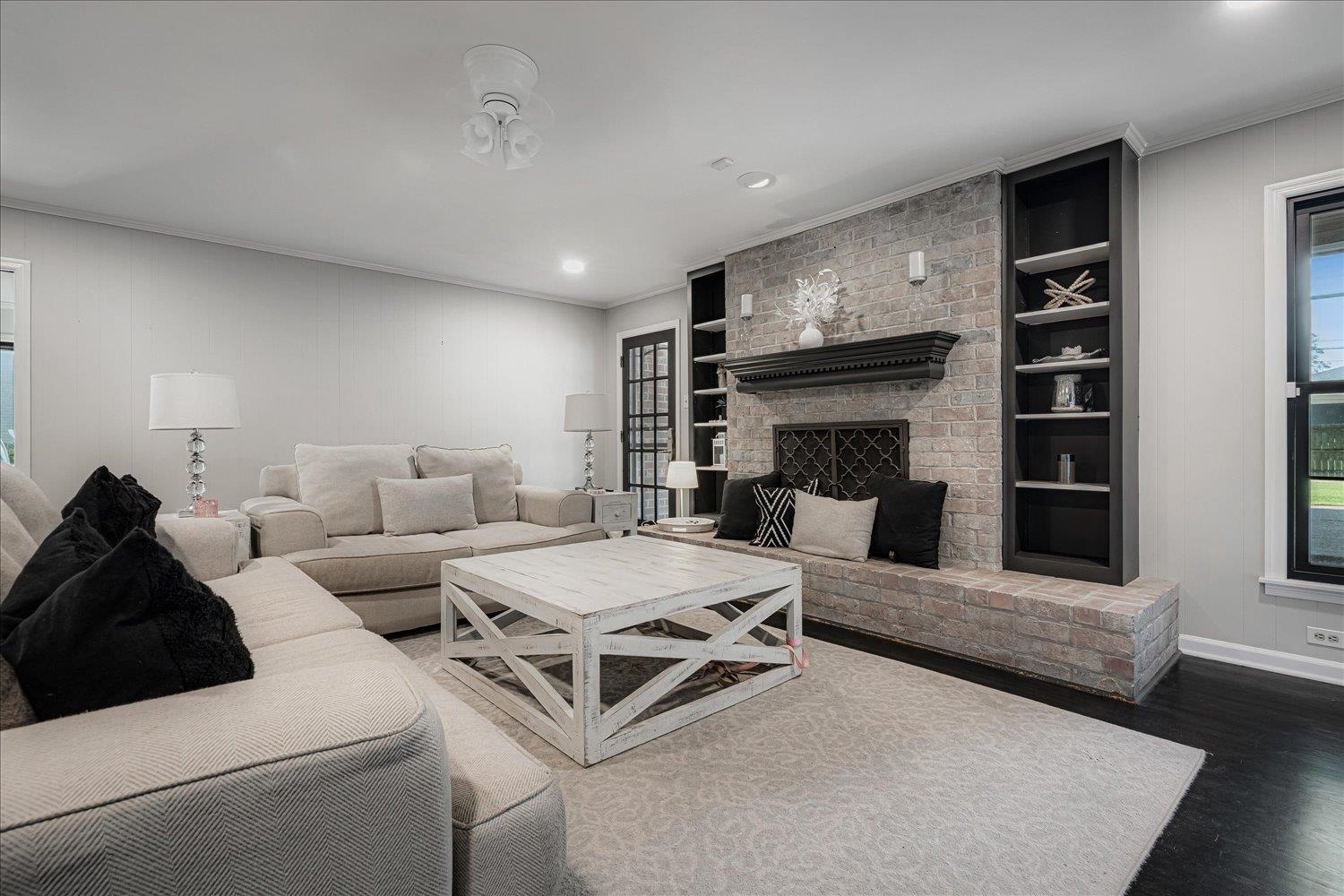 5429 Walnut Grove Road Memphis, TN 38120 - Photo 10 of 37 a living room with furniture and a fireplace