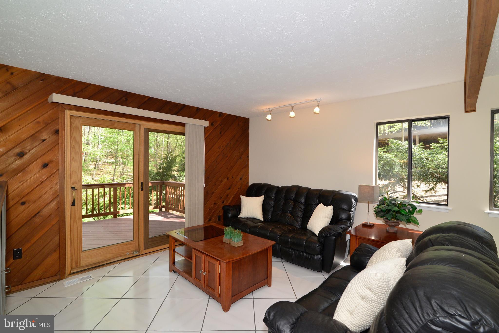 2203 Spinnaker Court Reston, VA 20191 - Photo 10 of 30 a living room with furniture and a large window