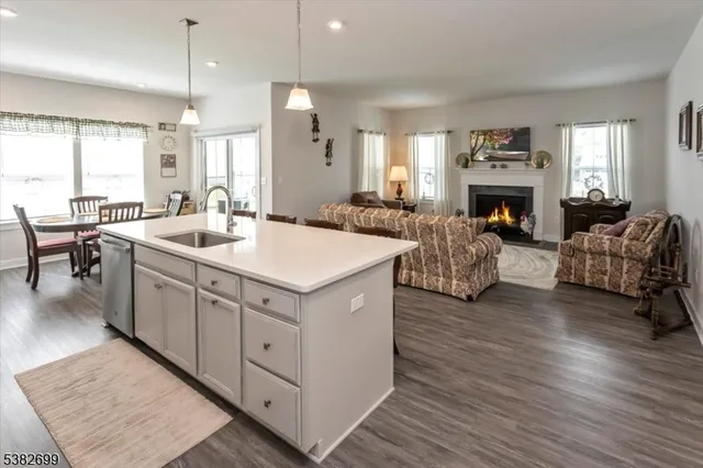 a view of living room with furniture and fireplace