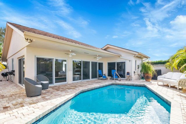 a swimming pool with outdoor seating yard and porch