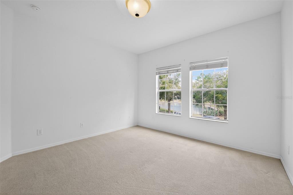 6071 Strada Isle Way Orlando, FL 32835 - Photo 14 of 29 an empty room with a window