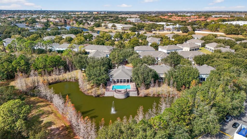 6071 Strada Isle Way Orlando, FL 32835 - Photo 27 of 29 an aerial view of residential houses with outdoor space and trees