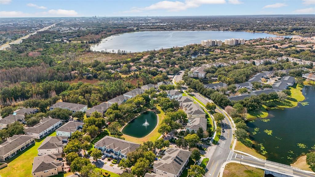 6071 Strada Isle Way Orlando, FL 32835 - Photo 28 of 29 an aerial view of a house with a lake view