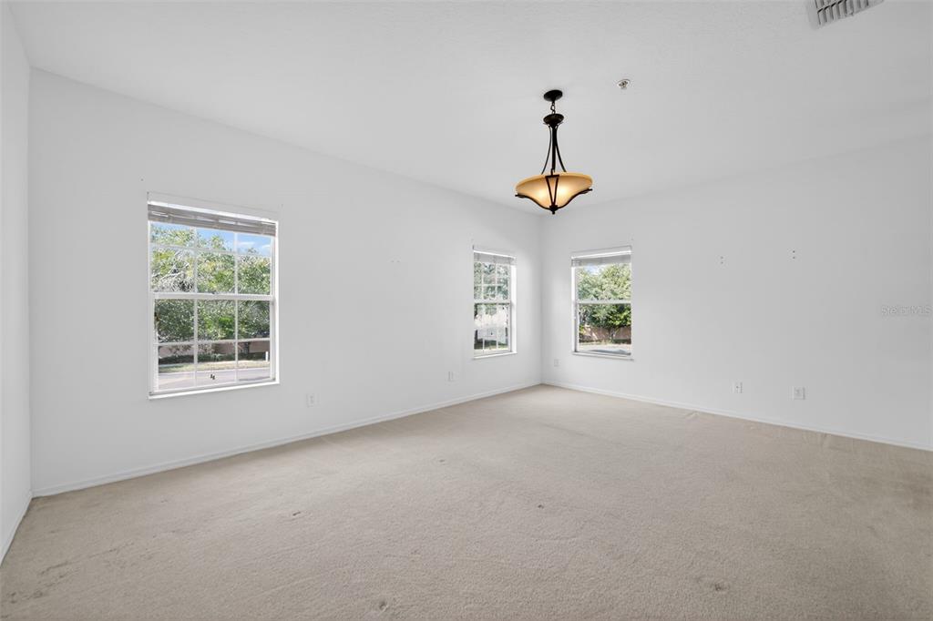 6071 Strada Isle Way Orlando, FL 32835 - Photo 5 of 29 an empty room with a window