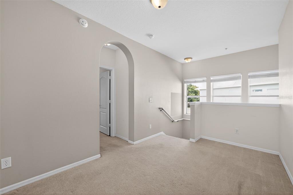 6071 Strada Isle Way Orlando, FL 32835 - Photo 6 of 29 a view of empty room with windows