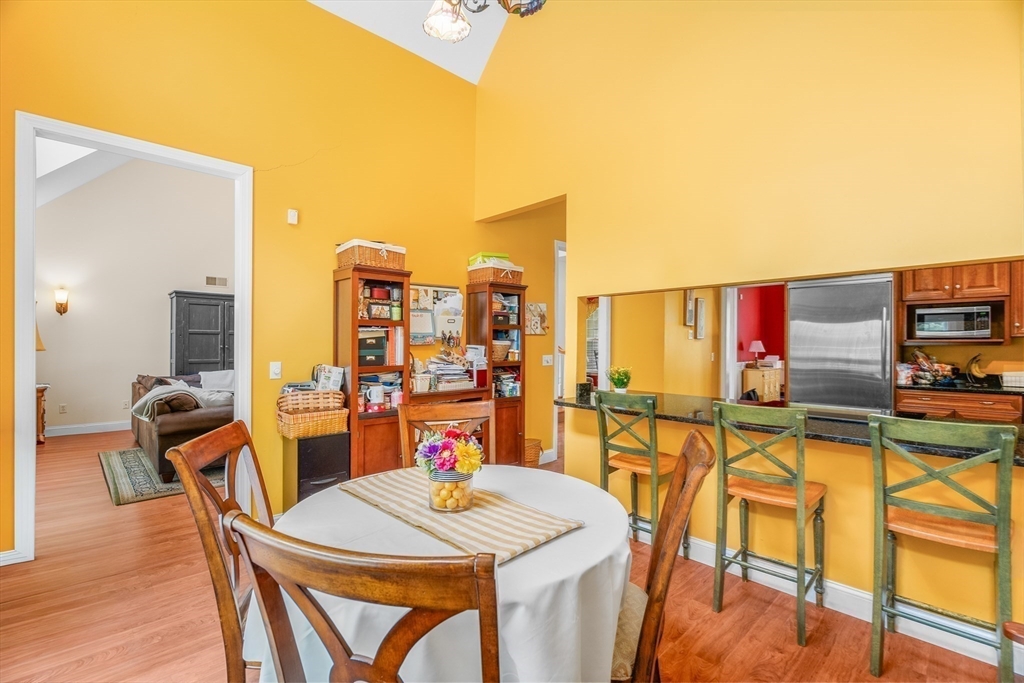 113 Greenwich Plains Road Ware, MA 01082 - Photo 12 of 42 a view of a dining room with furniture and a kitchen view