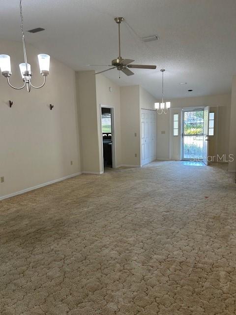 8602 Southwest 116th Place Road Ocala, FL 34481 - Photo 7 of 46 an empty room with kitchen view and a fireplace