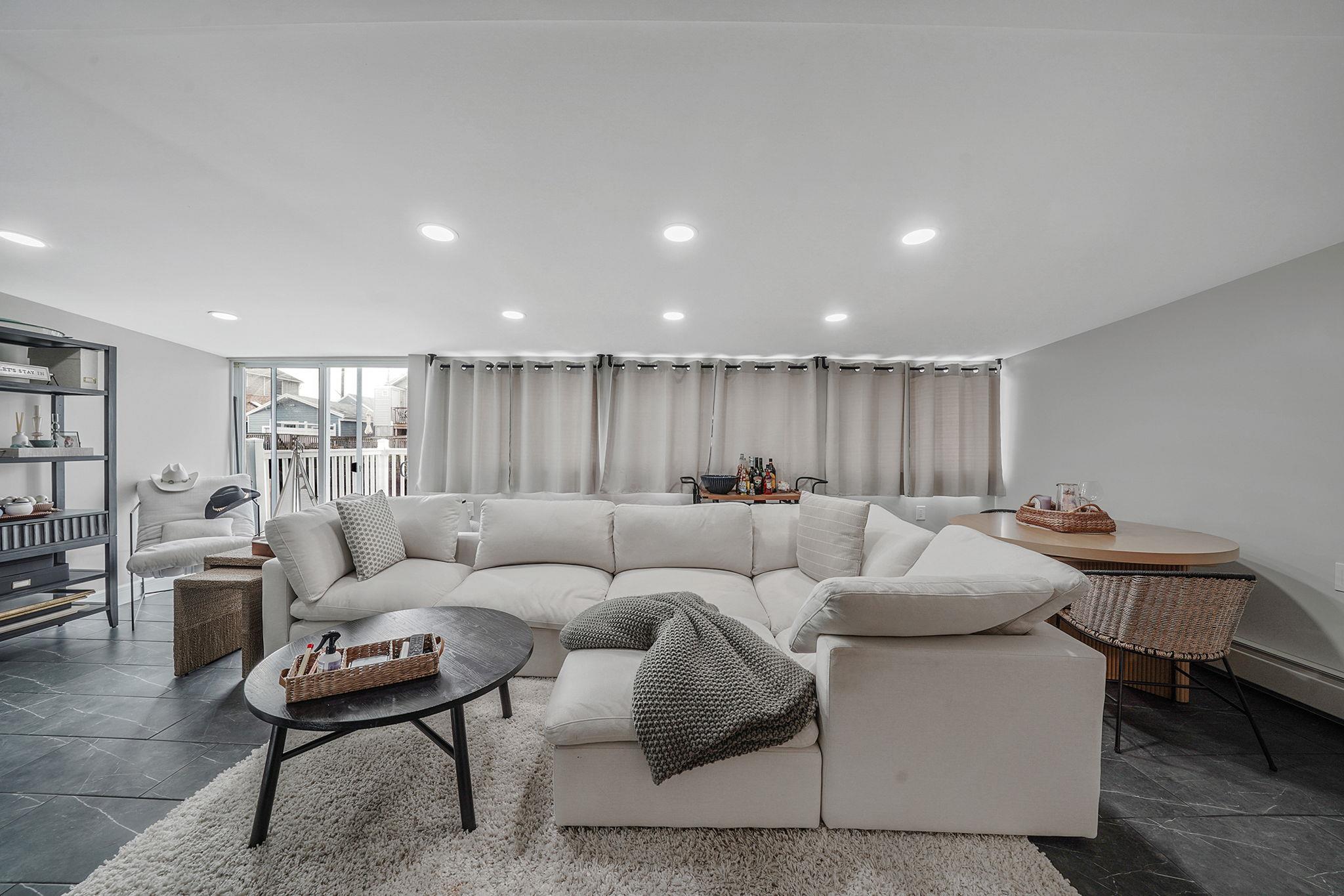 28 West 13th Road Queens, NY 11693 - Photo 18 of 37 a living room with furniture and a table