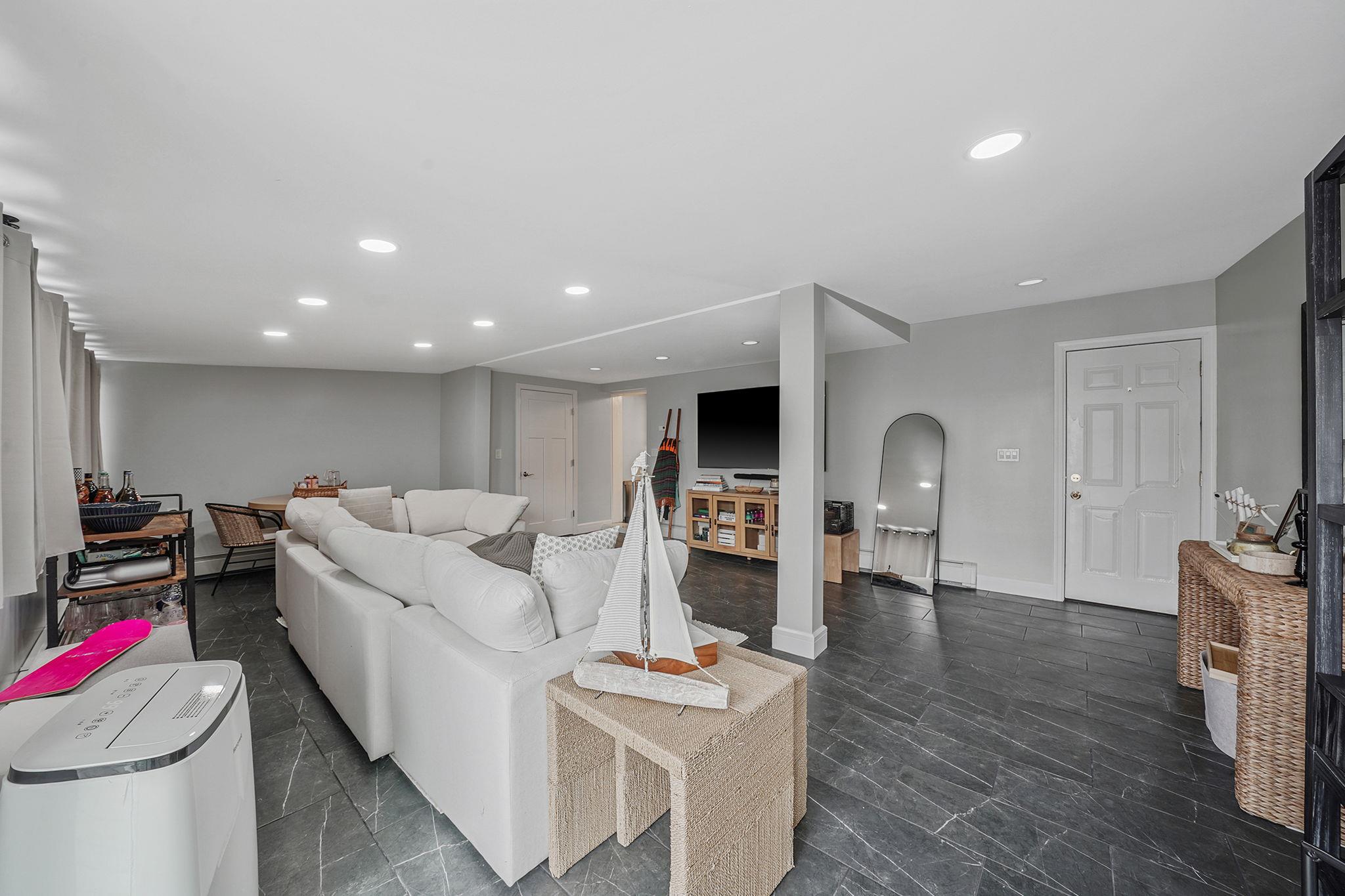 28 West 13th Road Queens, NY 11693 - Photo 20 of 37 a living room with furniture and a wooden floor