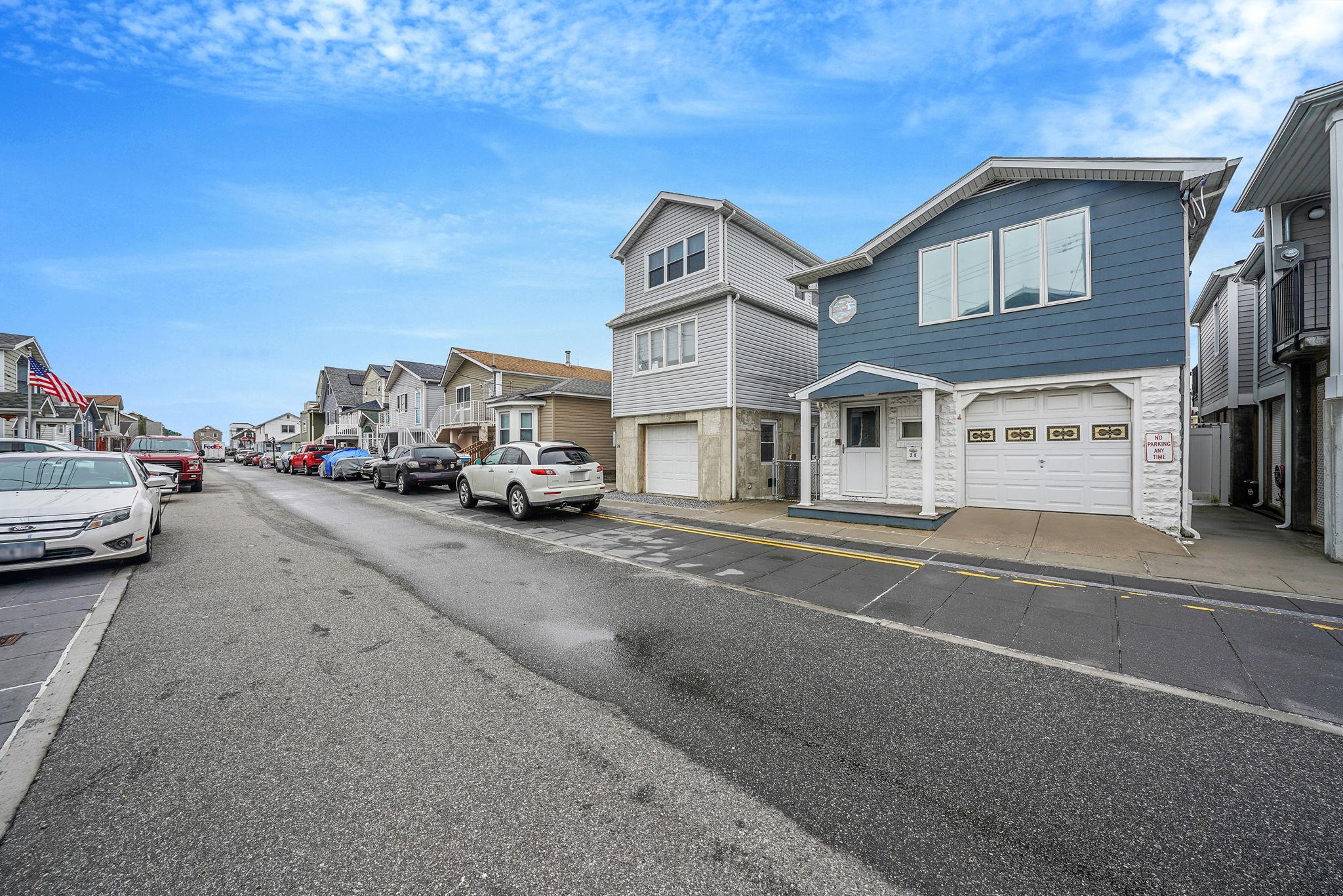 28 West 13th Road Queens, NY 11693 - Photo 3 of 37 a car parked on the side of a street