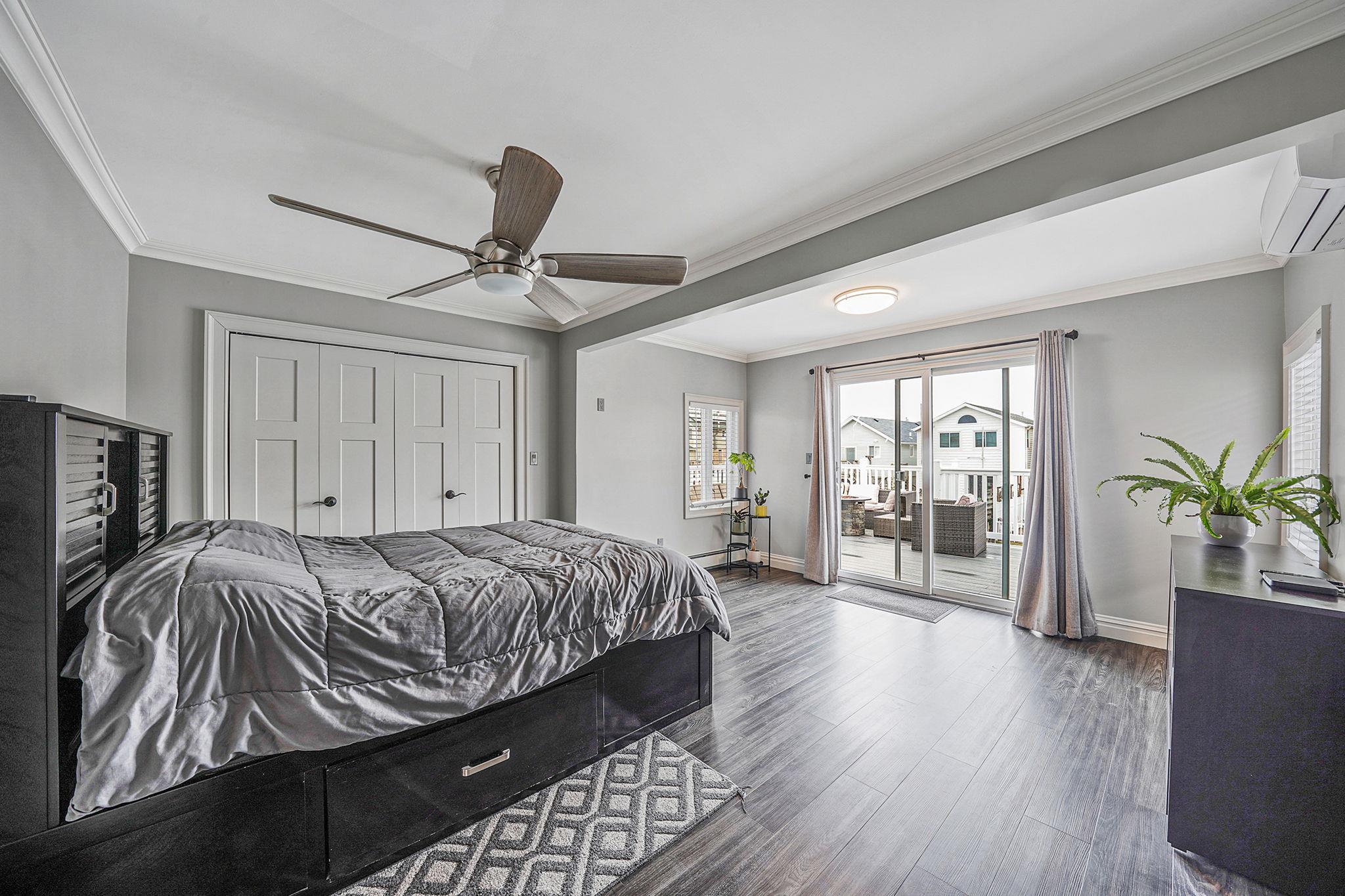 28 West 13th Road Queens, NY 11693 - Photo 29 of 37 a bedroom with a bed and a potted plant