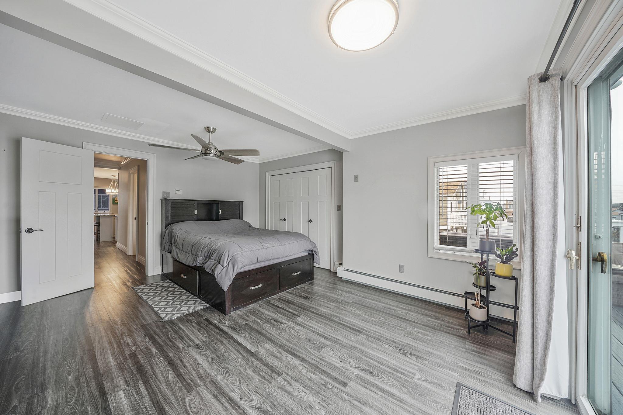 28 West 13th Road Queens, NY 11693 - Photo 30 of 37 a bedroom with a bed and wooden floor