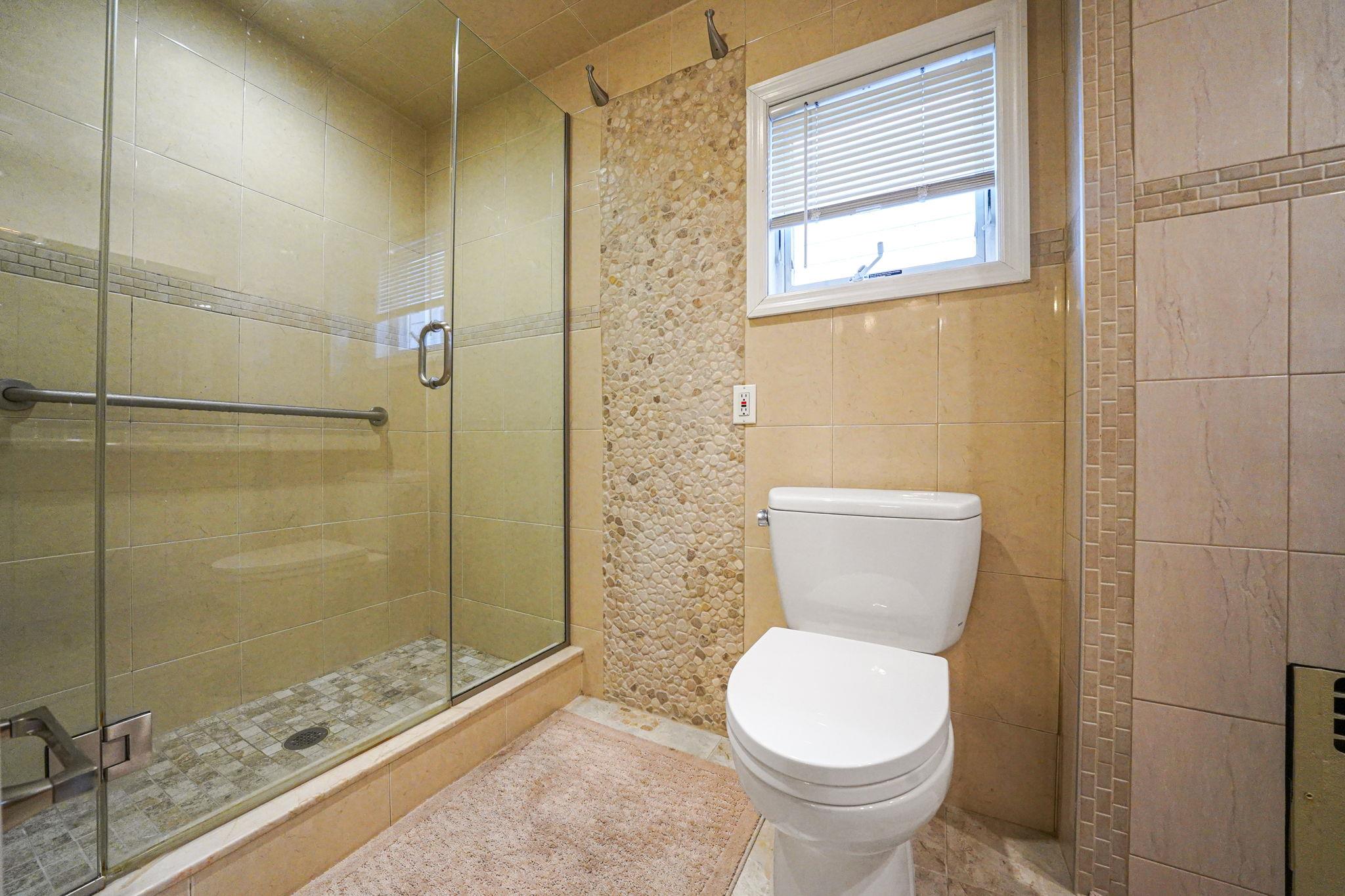28 West 13th Road Queens, NY 11693 - Photo 32 of 37 a bathroom with a toilet and a shower